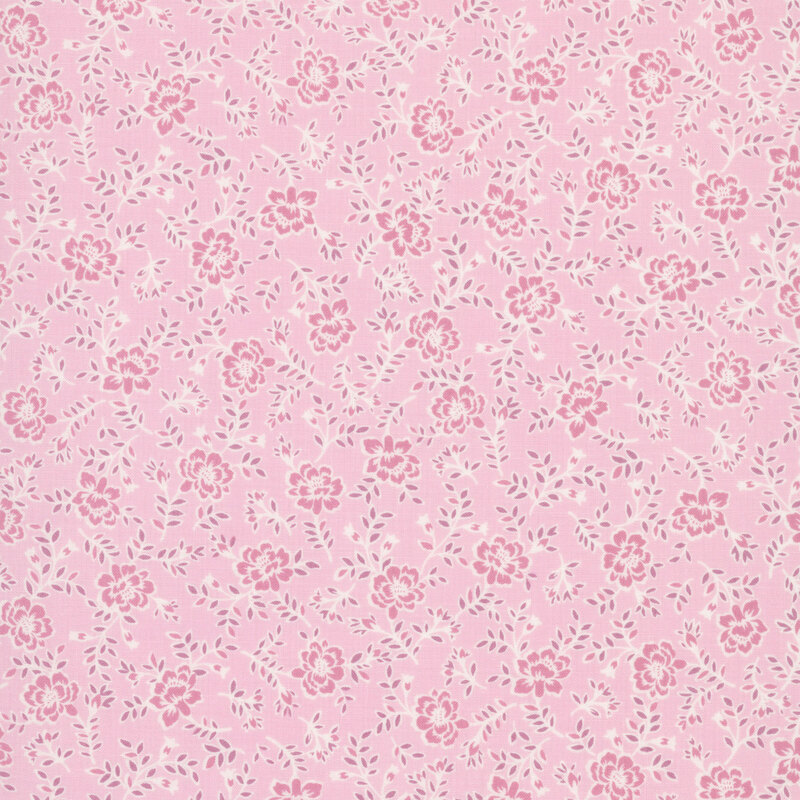 Soft pink fabric with tossed design of mid-size tonal roses and rose sprigs.