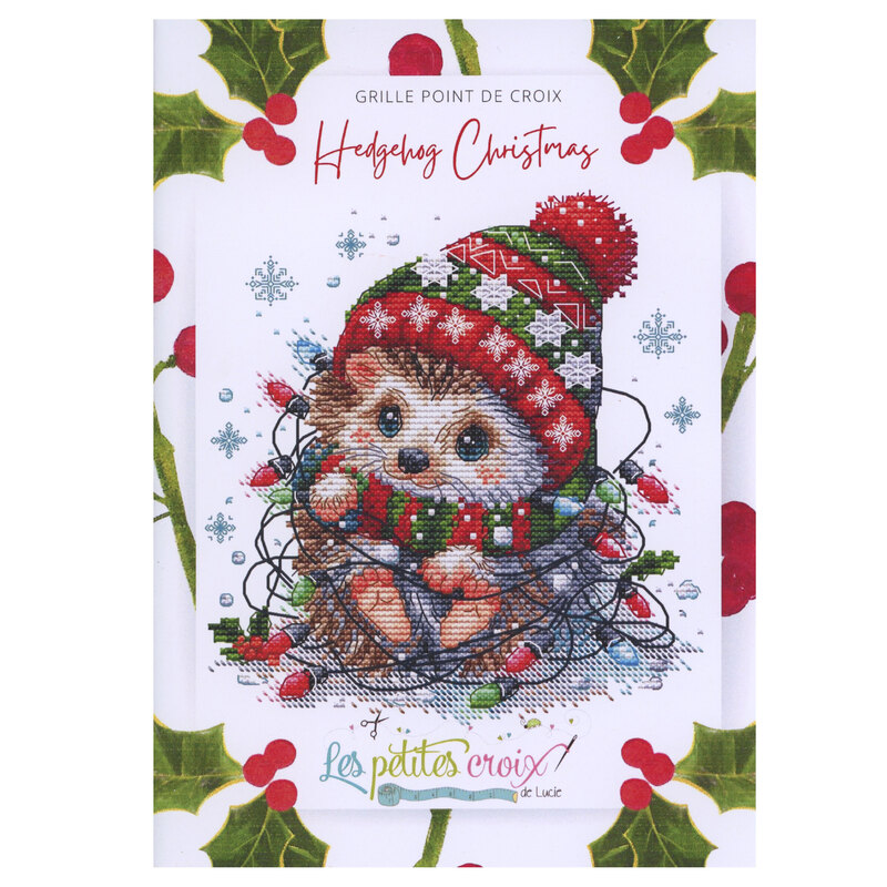 Front cover of pattern showing a digital rendering of the project, a sweet little hedgehog bundled up and tangled in christmas lights.