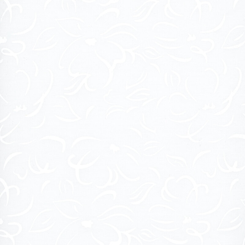 White batik fabric with a tonal stylized floral pattern