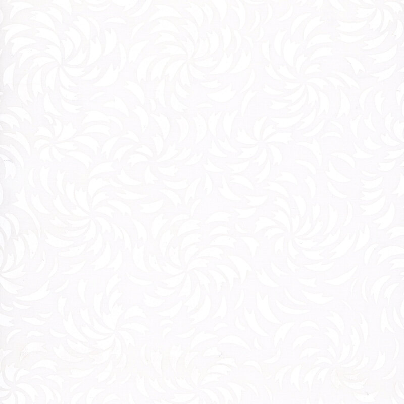 White-on-white batik with a swirling starburst pattern.