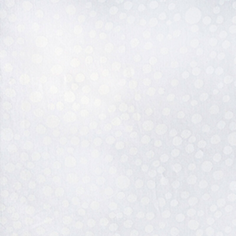 White-on-white batik with a scattered design of irregular circles.