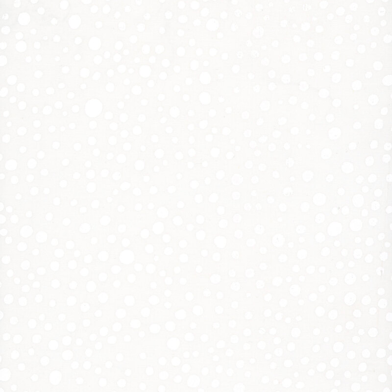 White-on-white batik with a scattered design of irregular circles.