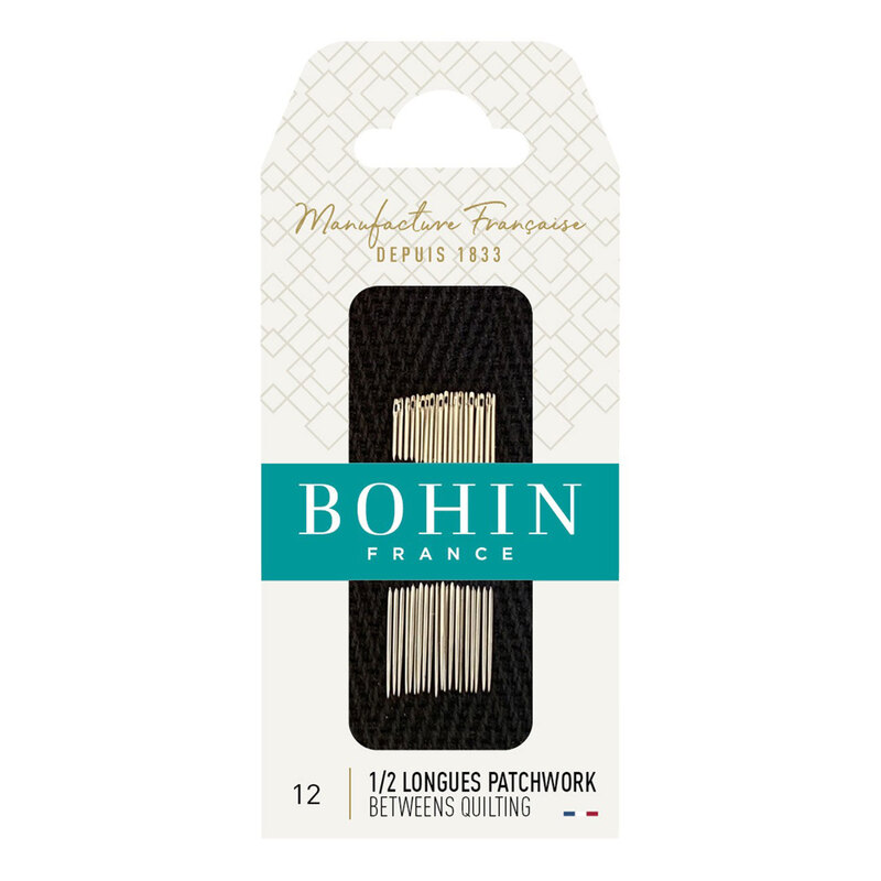 Bohin Between Quilting Needles in their decorative French packaging, isolated on a white background.