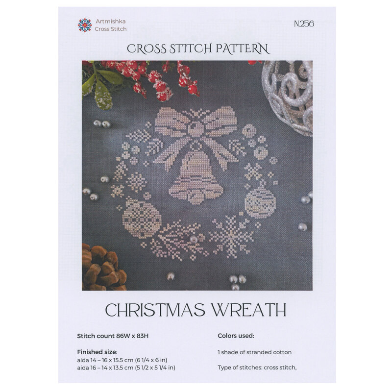 Front of pattern showing the completed cross stitch design with coordinating decor.