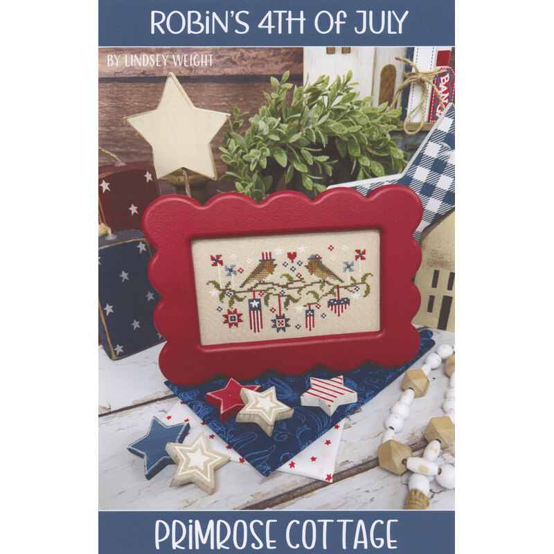 A patriotic cross stitch pattern featuring birds and stars, surrounded by decorative items.