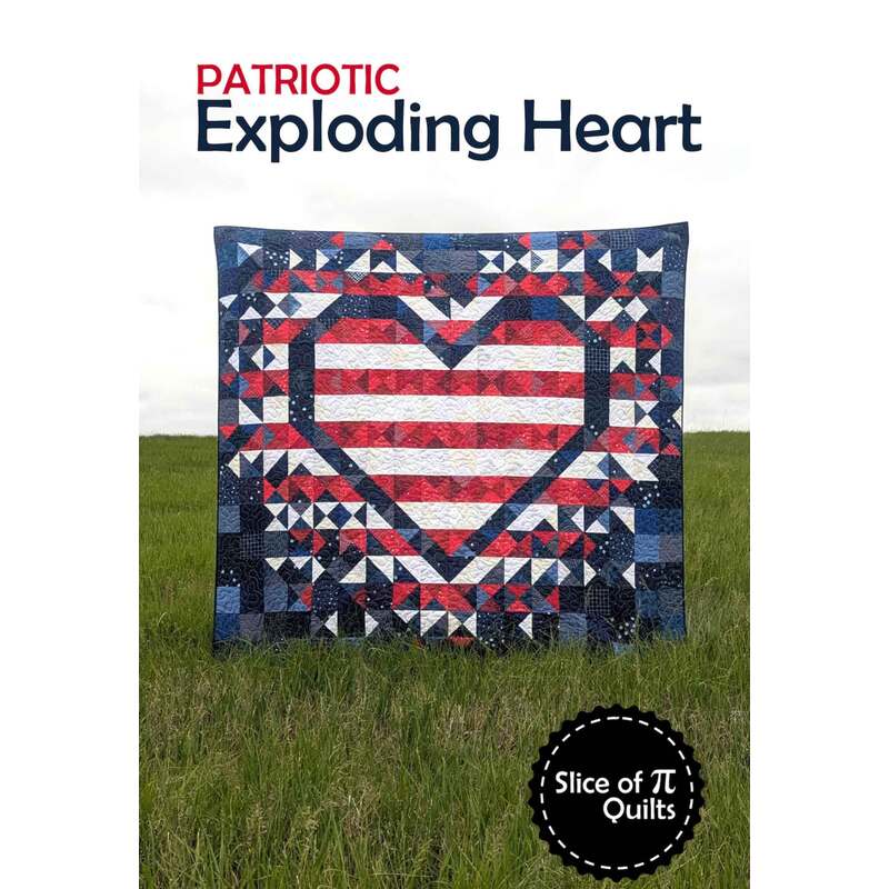 A quilt featuring a large heart design in red, white, and blue, set against a grassy background.