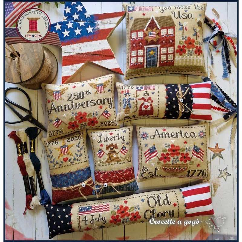 A collection of cross stitched designs from the Stars & Stitches series finished as pillows, celebrating American themes, including 4th of July and Liberty.