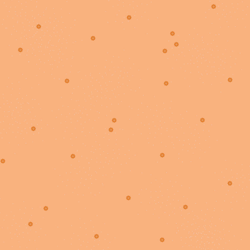 Tangerine fabric with small scattered rusty orange daisies and pin dots.