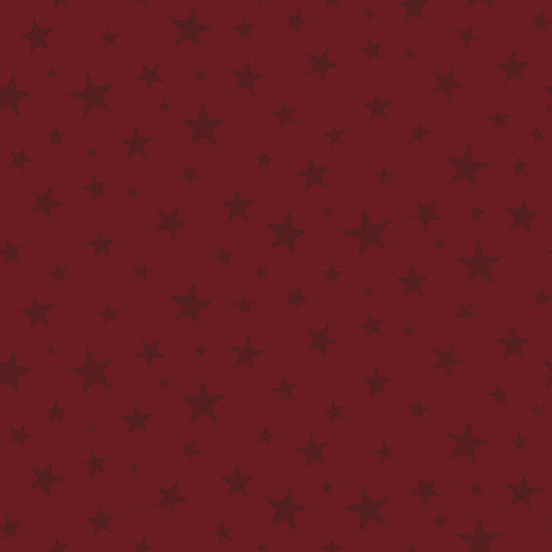Red tonal fabric tossed with stars of varying sizes.