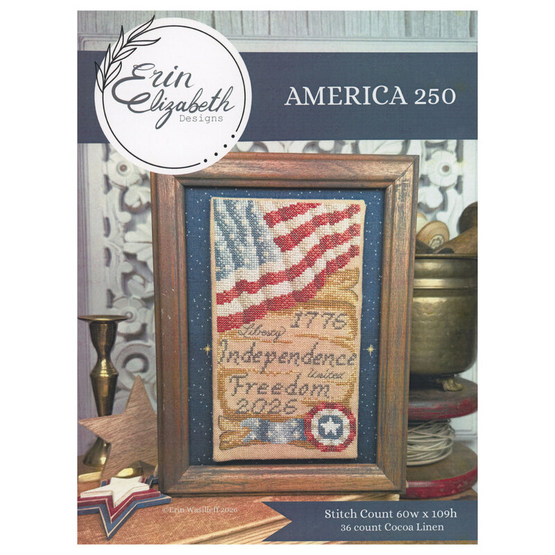 The front of the cross stitch pattern with the completed project framed and surrounded by coordinating décor. 