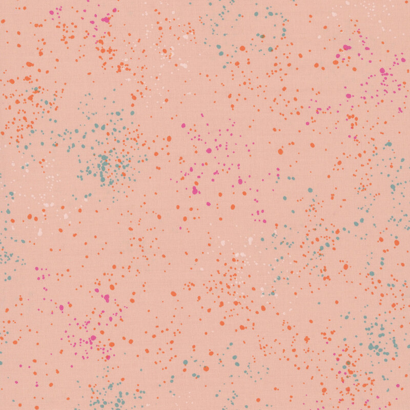 peach fabric with splatters of pink, orange, and teal.