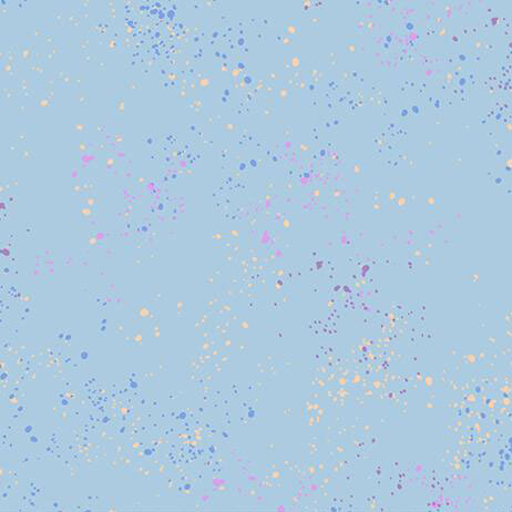Baby blue fabric with natural splatters of yellow, dark blue, purple, and pink.