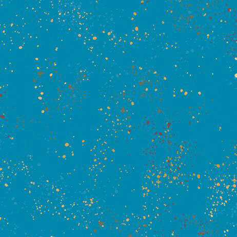 Bright cerulean blue fabric with natural metallic splatters of yellow, orange, light blue, and red.
