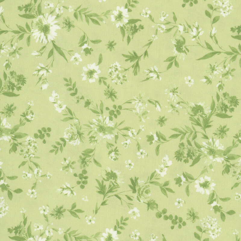 Green florals scattered on a pistachio green fabric.