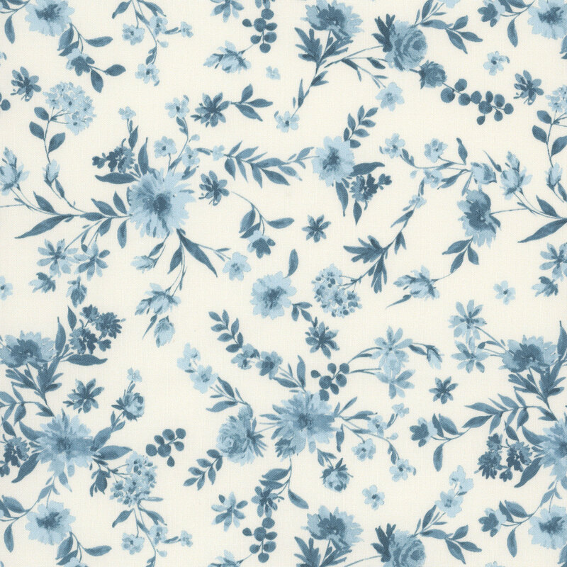 Light blue and dark teal florals scattered on a cream fabric.
