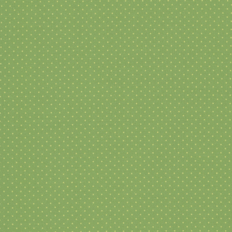 Soft green polka dots on a sage green fabric.