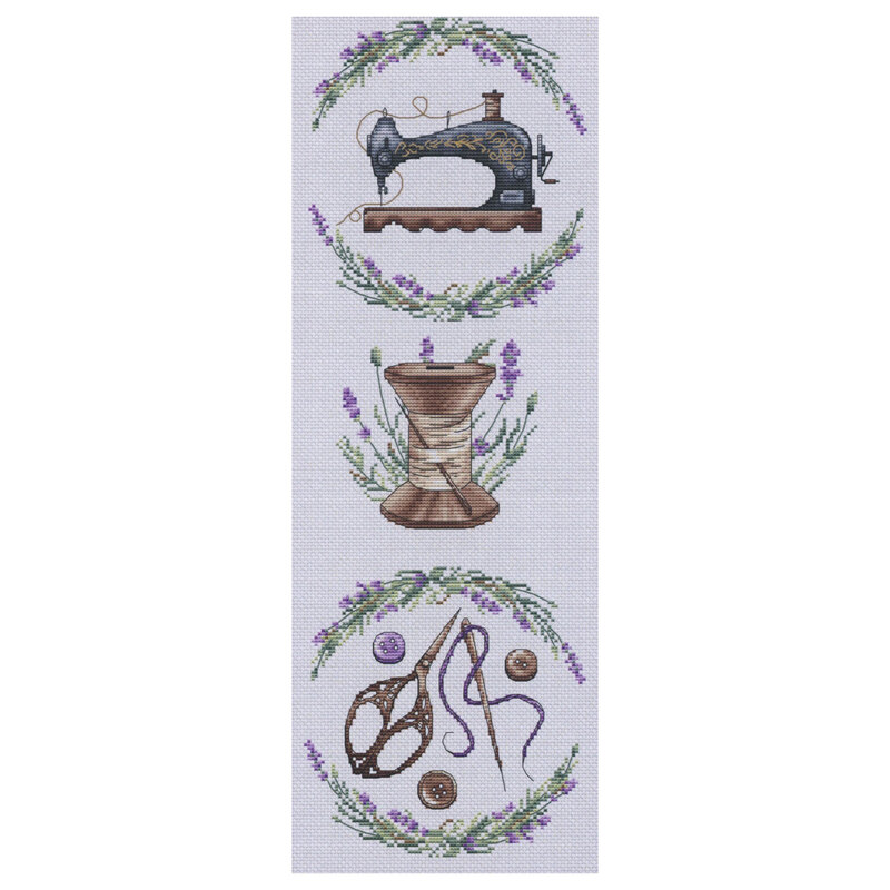 Image of the pattern featuring a sewing machine, spool of thread, and embroidery scissor motifs all surrounded by lavender sprigs.