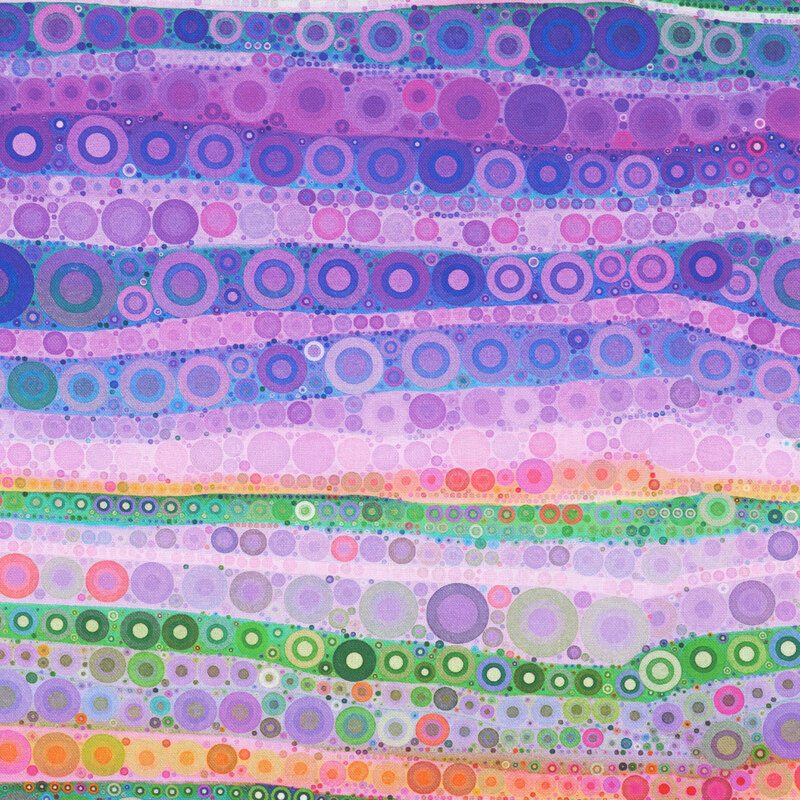 Multicolored fabric with wavy bands of circles and dots.