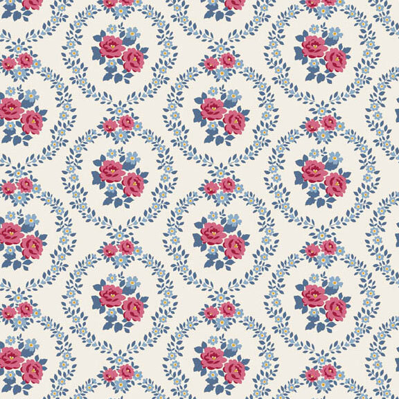 This white fabric features burgundy and blue floral wreaths framing centerpieces. 
