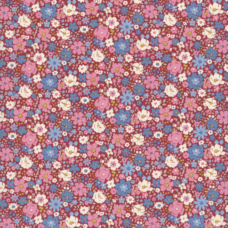 This burgundy fabric features packed florals in lovely shades of pink, teal, white, and ochre. 