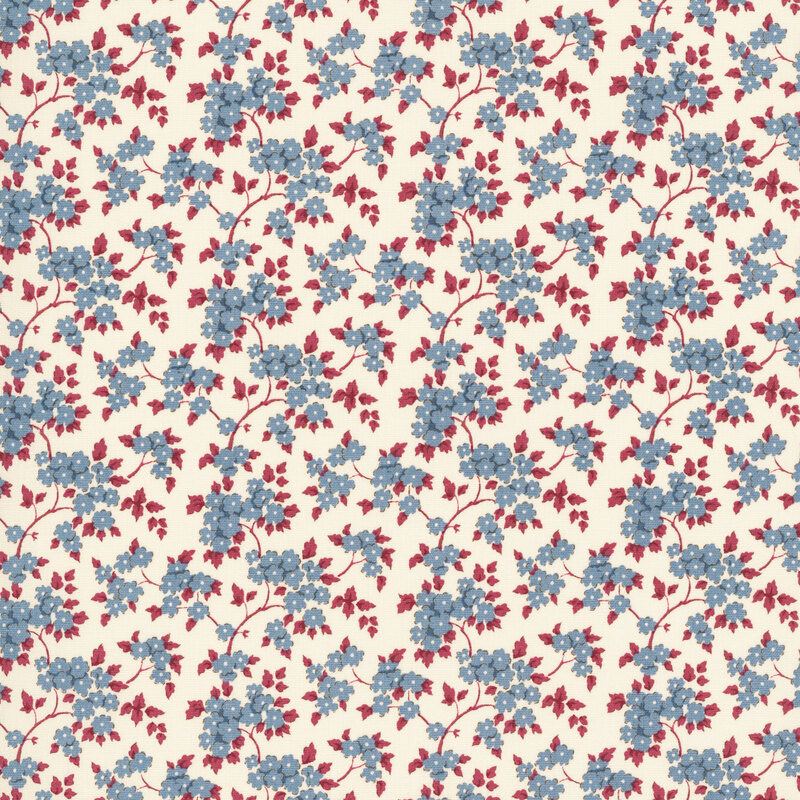 This white fabric features tossed blue flowers with burgundy leaves.