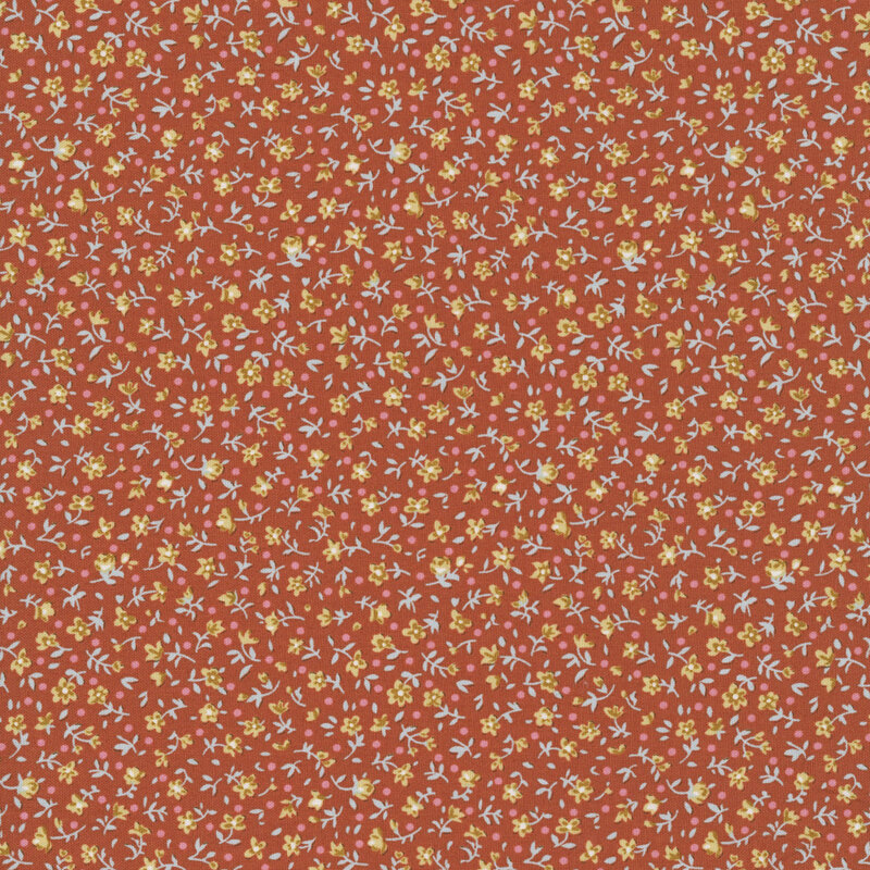 This rust orange fabric features a ditsy print of ocher flowers with pink dots.