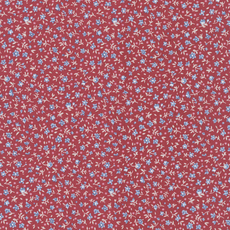 This burgundy fabric features a ditsy print of blue flowers with pink dots.