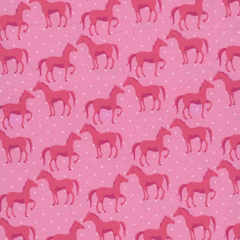 A magenta fabric with horses and polka dots.