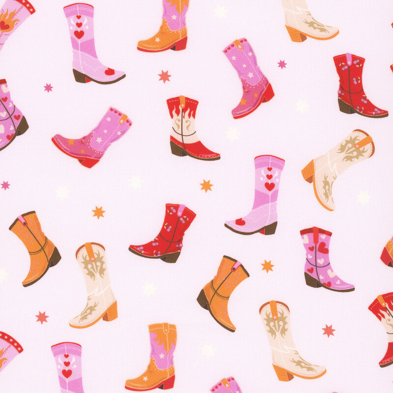 A pink fabric featuring cowgirl boots and stars.