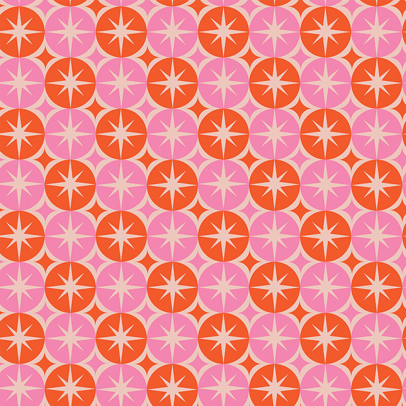A multi-colored fabric featuring pink and orange circles and stars. 