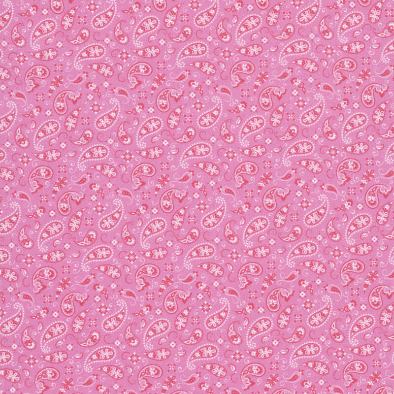 A pink fabric featuring a paisley design. 