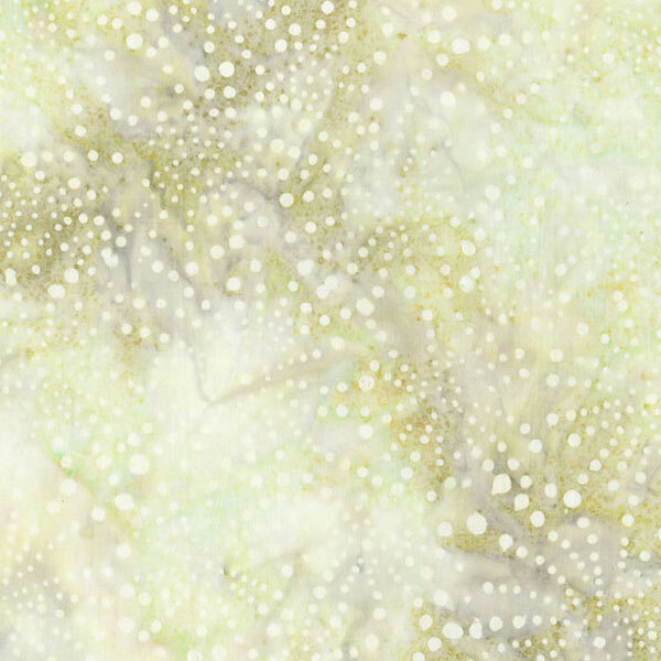 A mottled light lemongrass fabric featuring dots arranged in a firework motif.