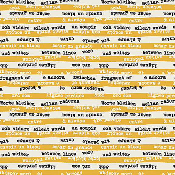 Yellow fabric full of words with stripes of off-white.