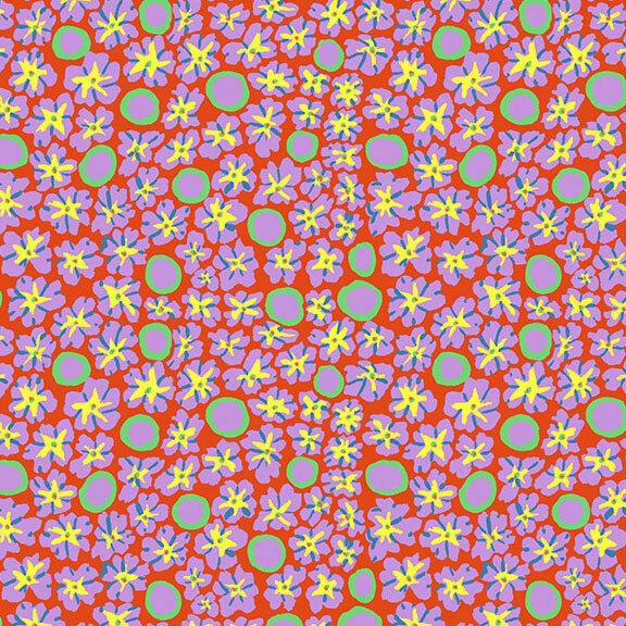 Rusty orange fabric with a packed design of bright yellow, lilac, and mint florals and circles.