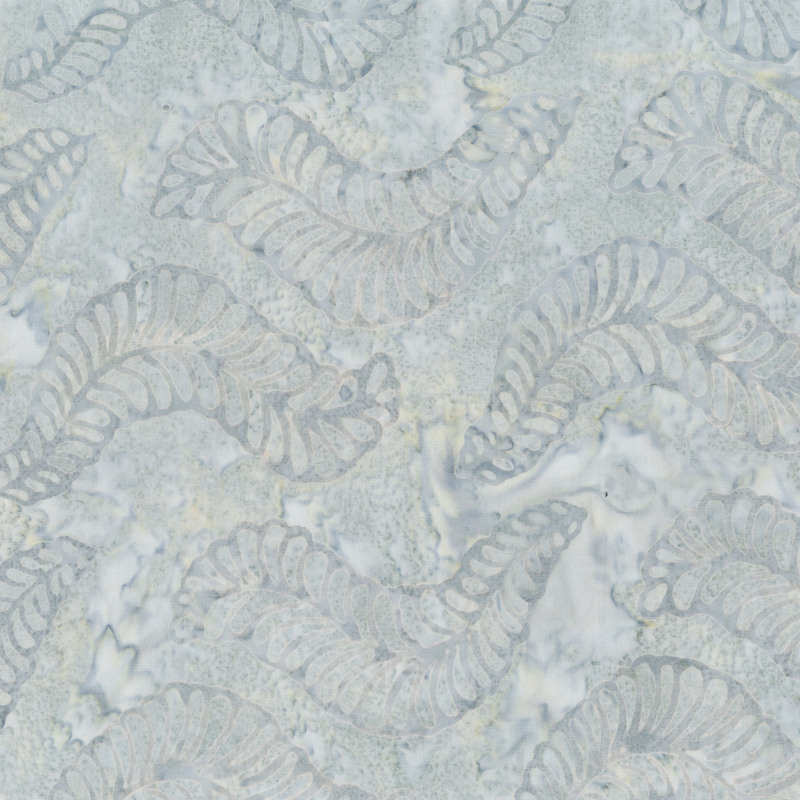 Light gray batik with cool gray leaves over the top.