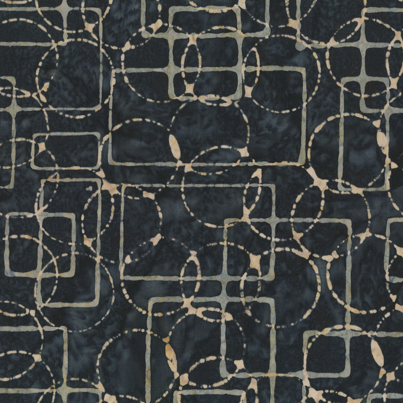 Coal gray batik with tan circles and rectangles over the top.