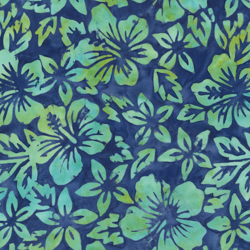 Turquoise florals over a lagoon blue batik.