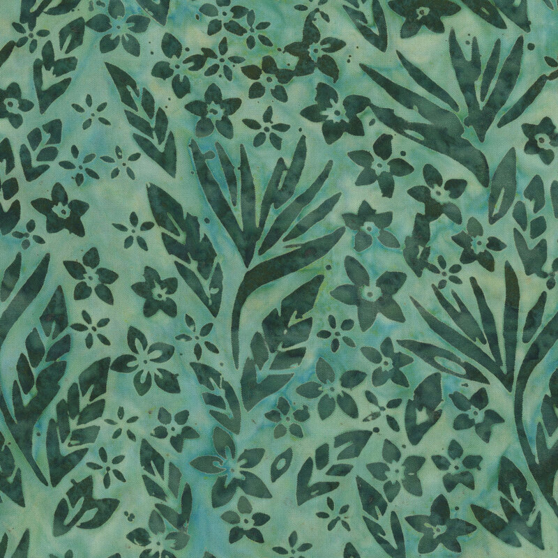 Dark green leaves and florals over a teal batik.