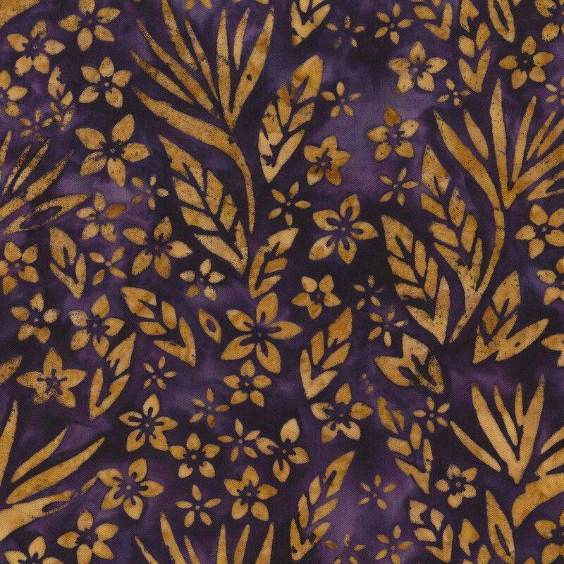 Gold leaves and florals over a dark purple batik.