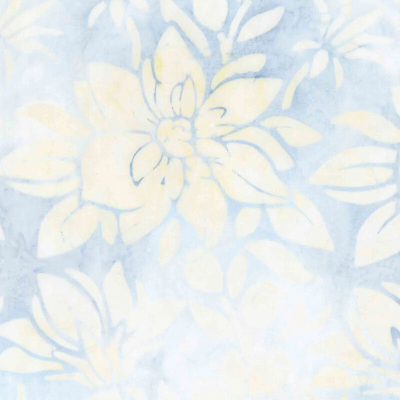Light blue batik overlaid with pastel yellow florals.