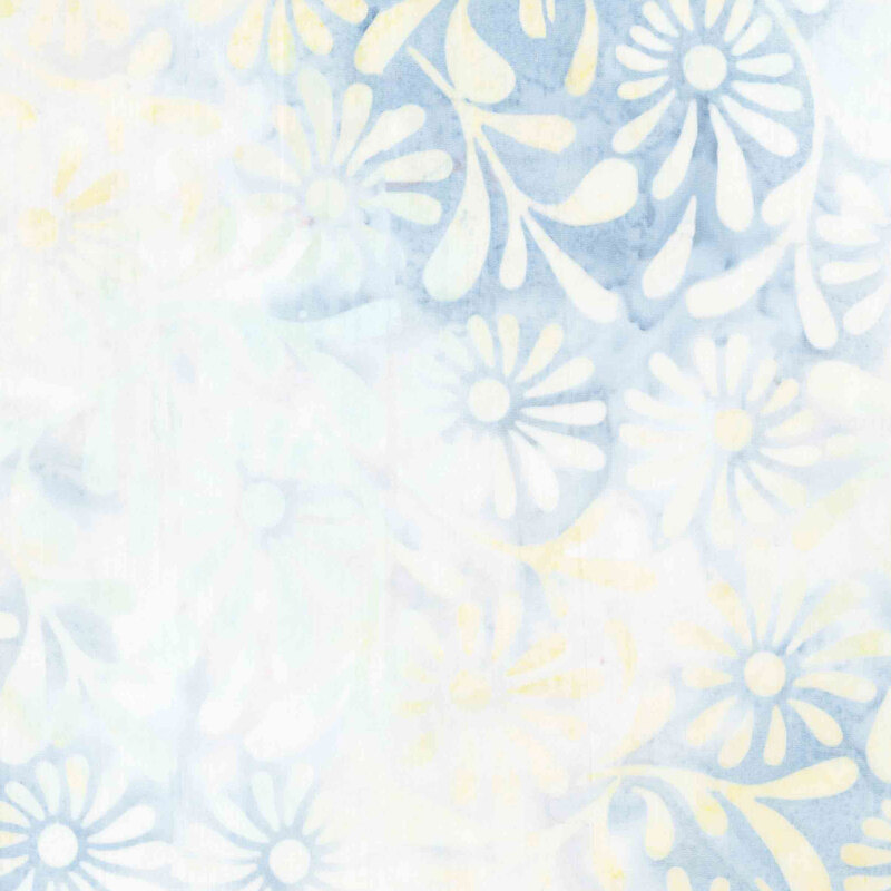 Light denim blue and cream batik overlayed with yellow and white florals.