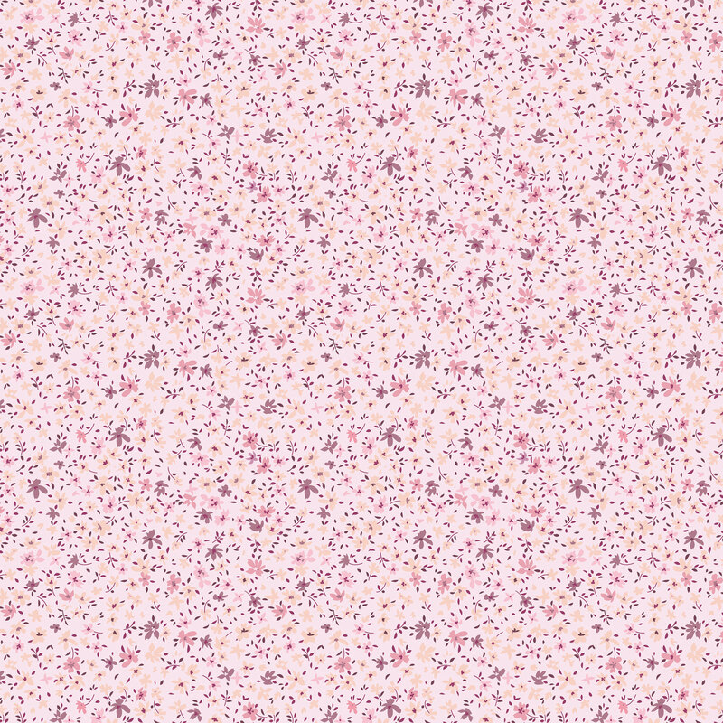 Faded pink tonal fabric with small calico florals strewn on top.
