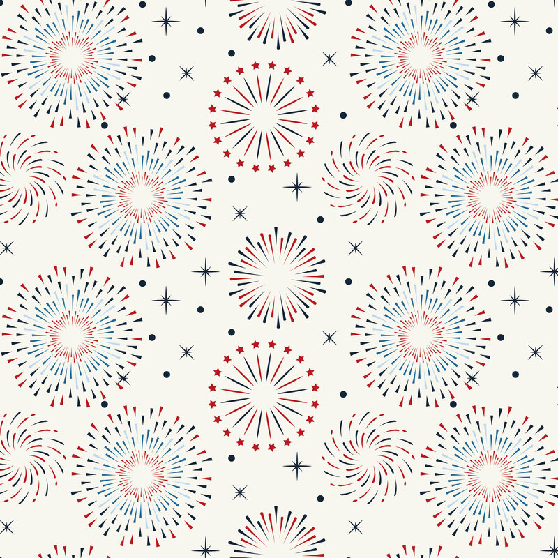 Cream fabric with bursts of blue and red firework motifs and stars.