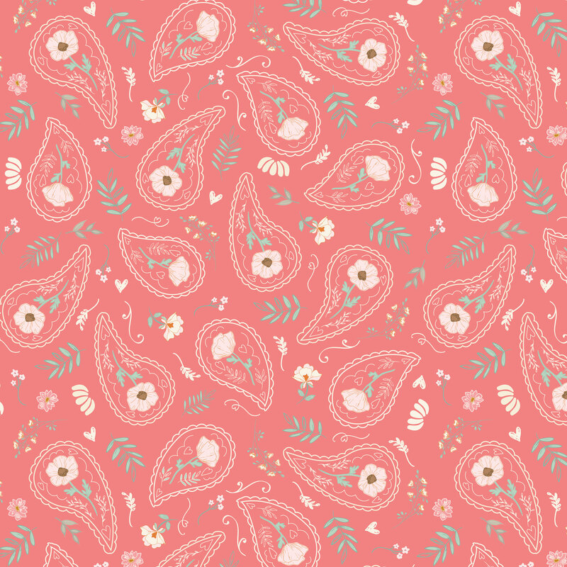 Salmon pink fabric with a tossed pattern of paisley motifs filled with florals, leaves, and assorted flowers.