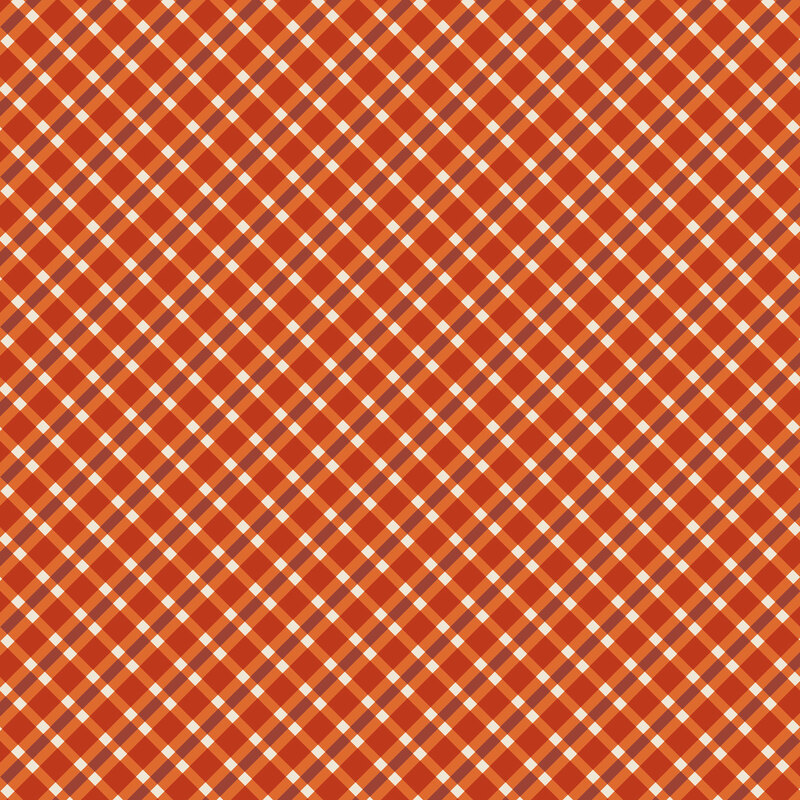 Pumpkin orange fabric with a tonal and white plaid pattern.