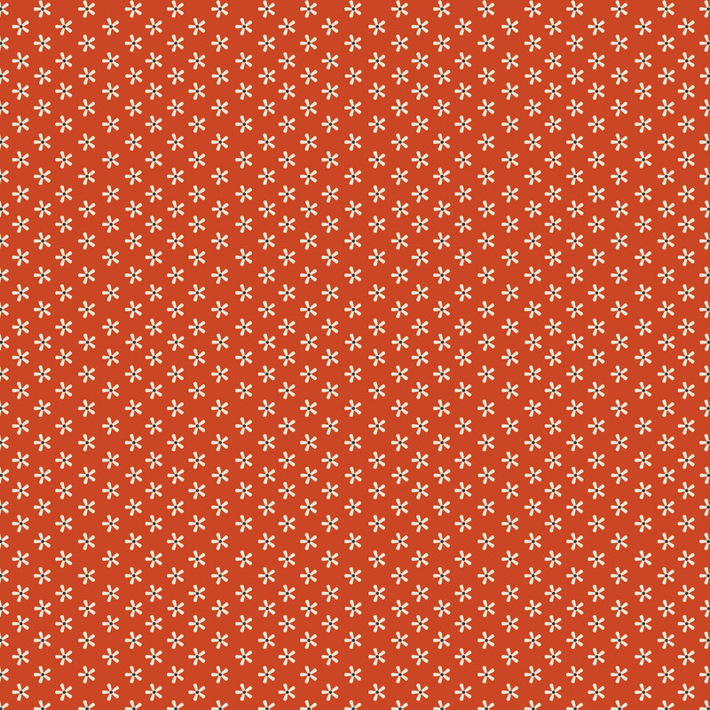 Rusty orange fabric with staggered grid of small white florals.