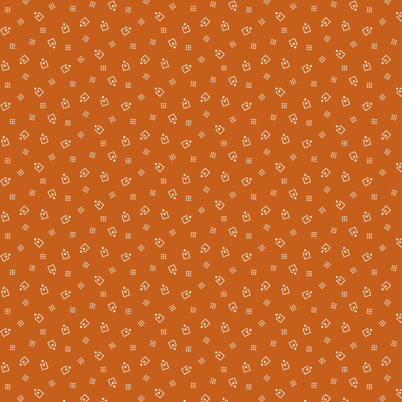 Amber fabric topped with scattered white squares and dots.