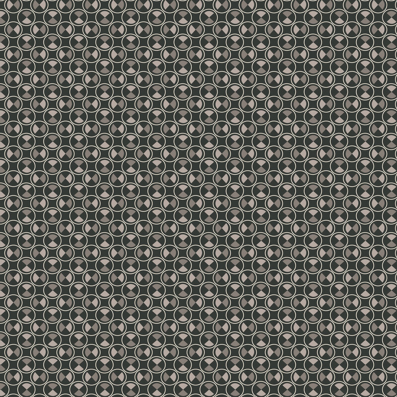 Dark gray fabric with packed half-drop circles with achromatic shapes inside.