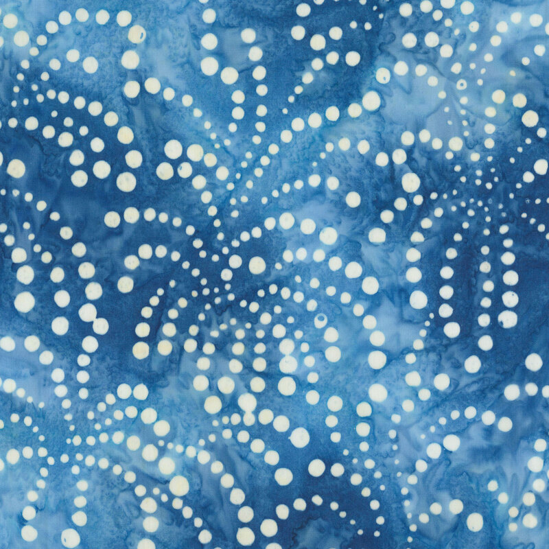 Lagoon and light blue batik scattered with bursts of cream dots.