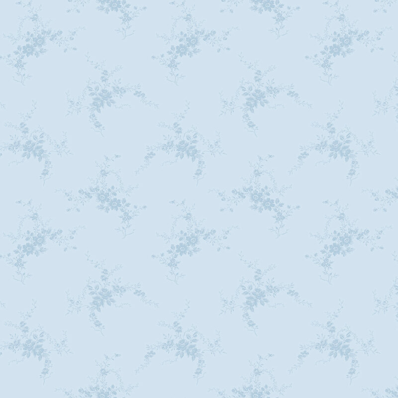 Light blue tonal fabric scattered with blue florals.